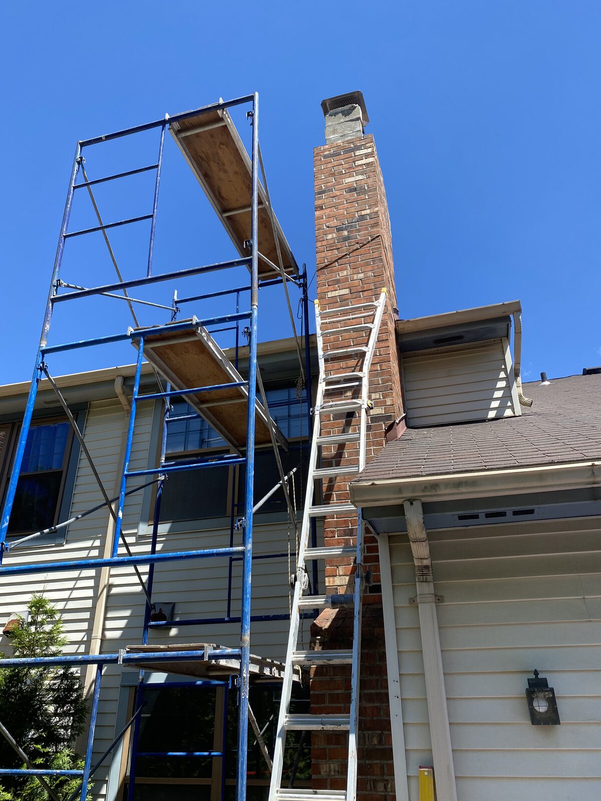Scaffolding set up for a full chimney restoration project